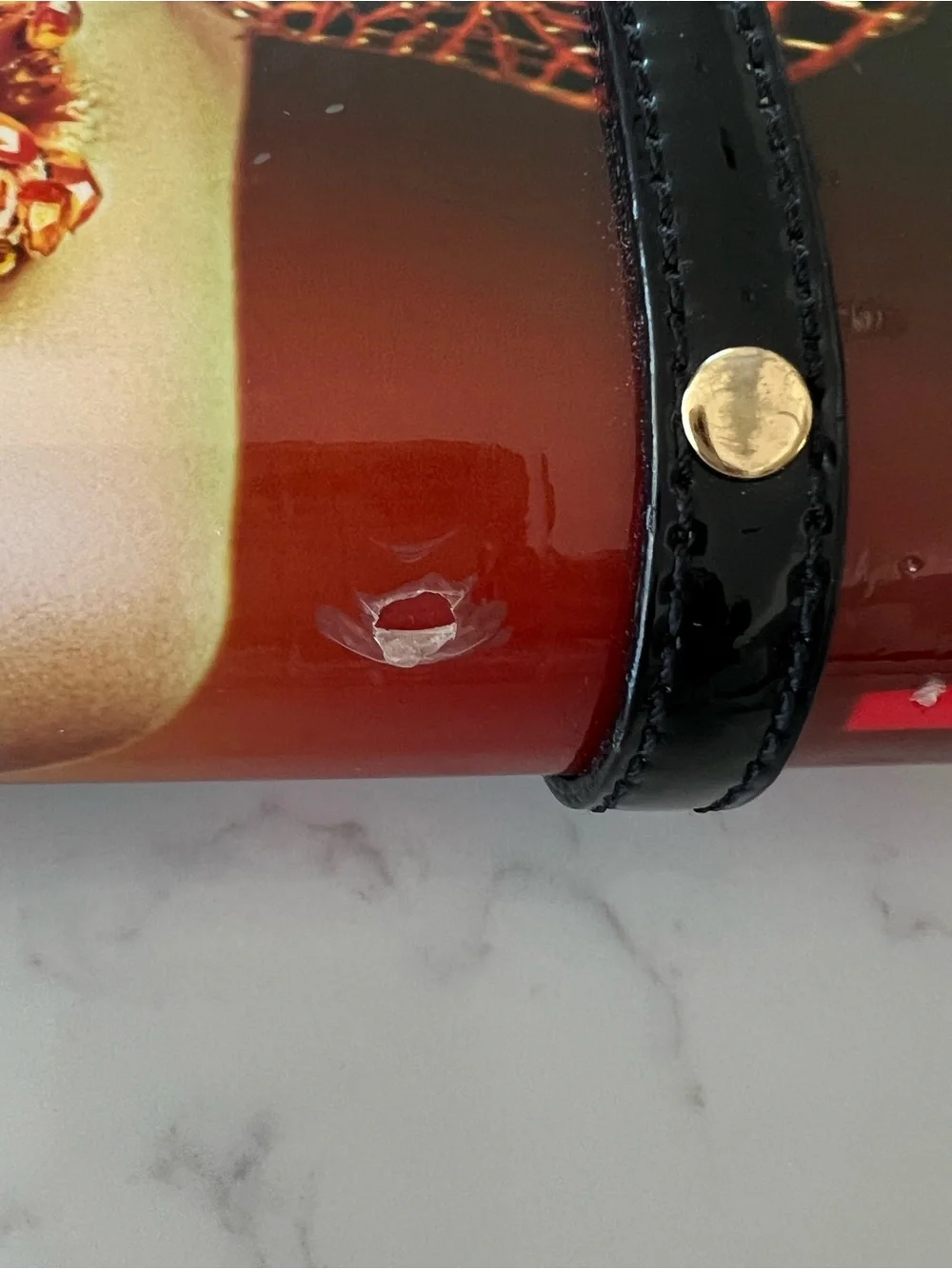 Edgy 80s rolled magazine clutch hard case with crossbody chain red and black